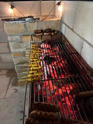 A bbq grill with food on it