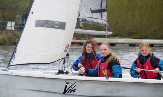 Young people on a sailing boat